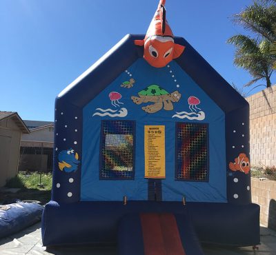 Colorful Finding Nemo inflatable bounce house with ocean-themed designs, perfect for children's parties and outdoor fun.