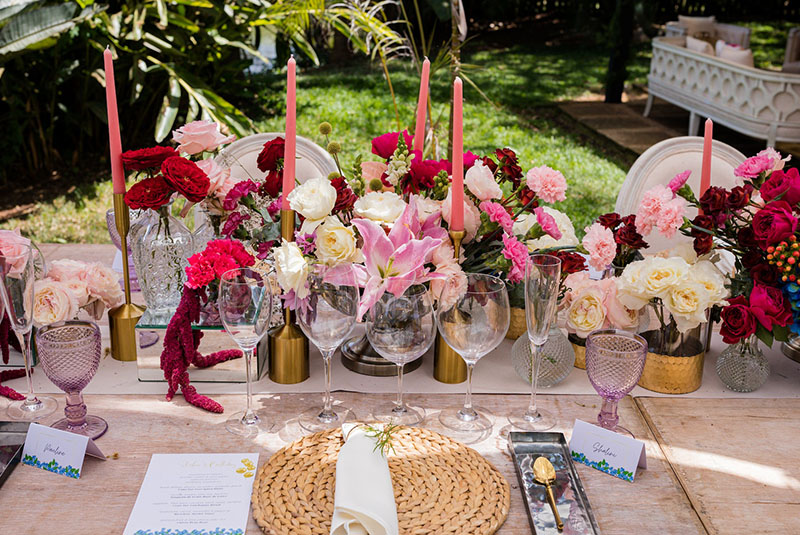 A beautifully arranged table featuring a vibrant bouquet of flowers and an elegant place setting.